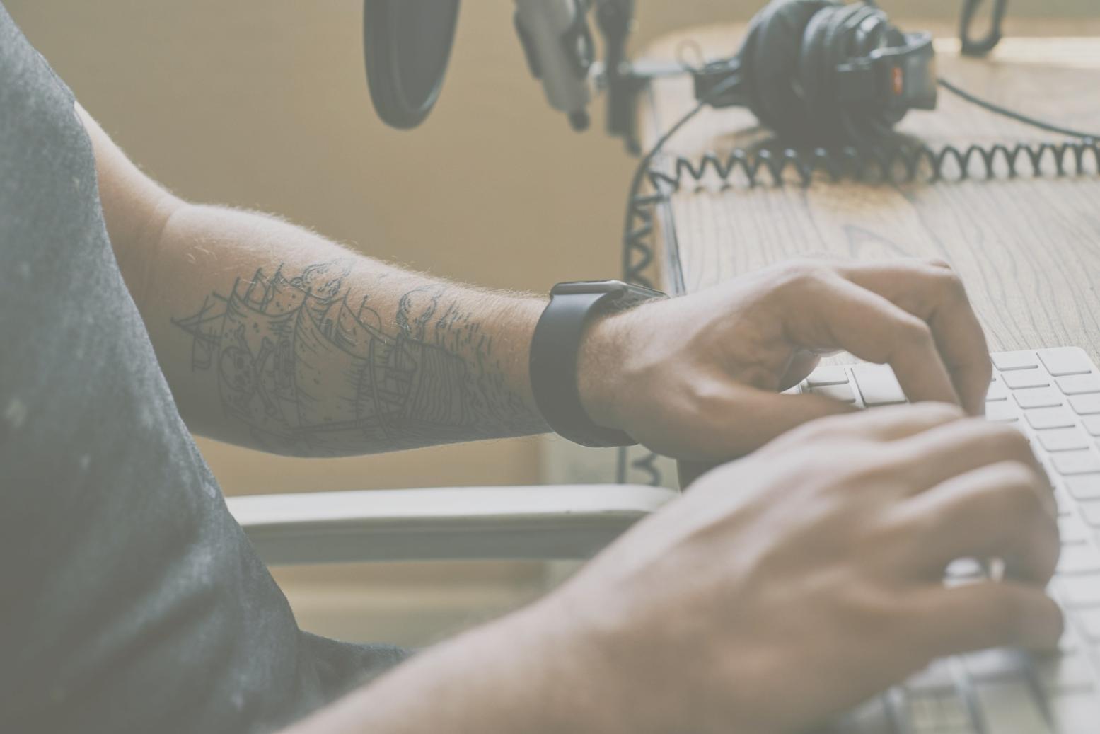 Security analyst reviewing code vulnerabilities on multiple monitors showing network topology and threat assessment dashboards