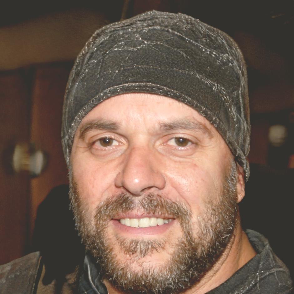 Ethan Blomberg, Lead Security Analyst at SyscodeFlow, reviewing penetration testing methodology documentation